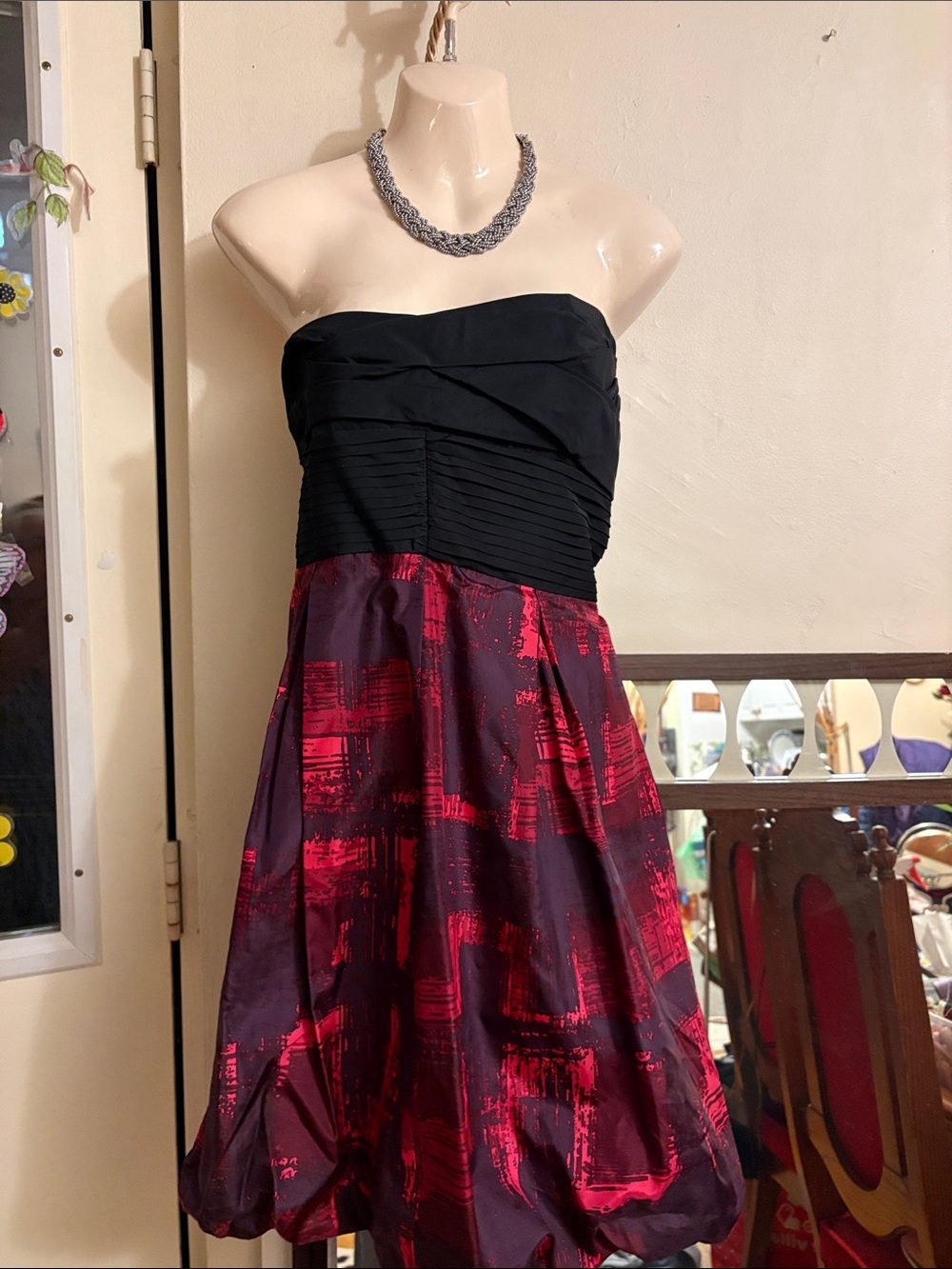 BCBGMaxAzria Strapless Black Bodice with Red and Burgundy Printed Bubble Skirt.